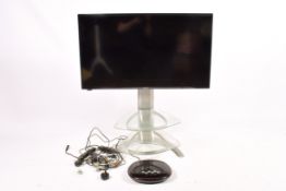 Panasonic TV on stand and Samsung H1080R DVD player. Both remotes present, not tested.