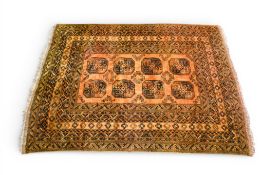 A vintage orange and black ground rug with geometric pattern.