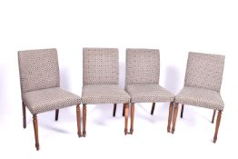 A set of four contemporary dining chairs.