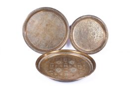 Three 20th Century Persian style brass trays. One with pierced sides.