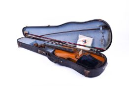 A vintage violin along with three bows.
