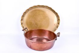 A large vintage copper jam pan with brass handles plus a oval brass tray.