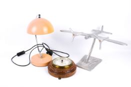 Cast aluminium model of an aeroplane, a barometer and a desk lamp. Largest H34cm. (3).