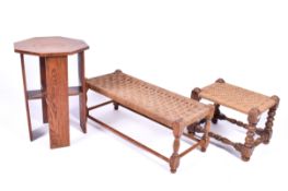 An Art Deco octagonal oak side table and two footstools.