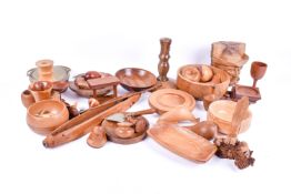 A large group of carved and turned treen items.