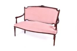 A c1920 French Louis XVI style Canape open arm sofa with carved mahogany frame finished in pink