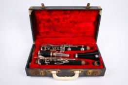 A Boosey & Hawkes Regent clarinet, cased. S/n 269862, with spare mouth piece.