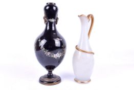 Richardson of Stourbridge opaque white glass ewer and a Victorian black glass vase decorated with