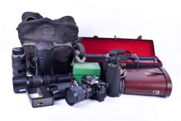 A collection of assorted cameras, lenses and a pair of binoculars, etc.
