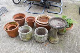 A selection of terracotta and reconsituted stone garden pots.