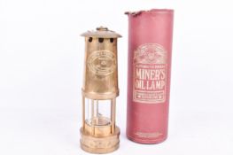 An E Thomas & Williams Ltd brass miners lamp. Constructed in Wales, H25.5cm (excluding hook).