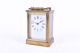 A brass five glass carriage clock with key.