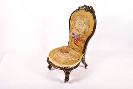 A Victorian mahogany nursing chair.