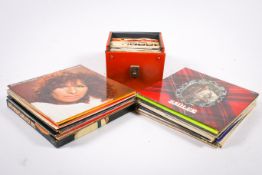 A collection of assorted 1970s and 80s vinyl LP records and 7