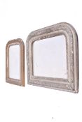 Two arched top over mantle wall mirrors with moulded frames.
