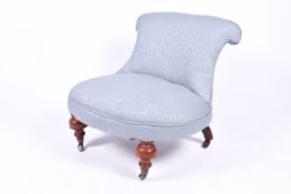 A 20th century nursing style chair.