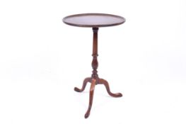 A George III mahogany snap top tripod wine table.