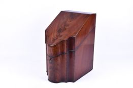 A Georgian mahogany cutlery knife storage box. Having serpentine front with a sloped lid.