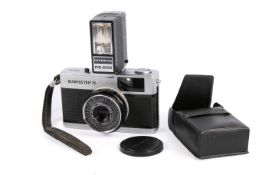 A vintage Olympus Trip 35, 35mm camera. Along with an Olympus PS200 flash.