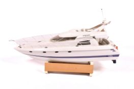 A modern radio control model luxury motor yacht 'Najade' by Robbe on stand.