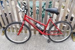 A red Raleigh Ogre Max 18 speed mens bicycle. 26' wheels. Tyres inflated and gears shift.