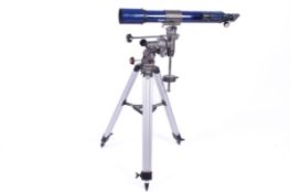 A Skylux refractor telescope on a tripod. F=700 D=70. Complete with manual. Approx H105cm x L75cm.
