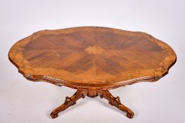 A reproduction elm coffee table.