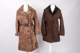 An Astrakhan and brown sheepskin coat.