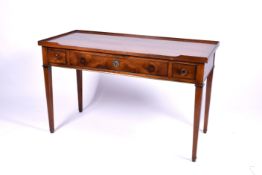 A 20th century Georgian style oak writing table or desk with three drawers.