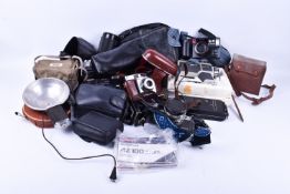 A collection of vintage 35mm film cameras including Pentax,Olympus and Petri.