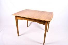 A Mid-century mahogany extending dining table.