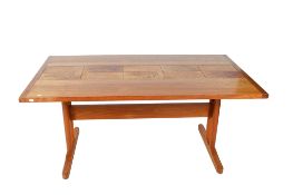 A mid-century Danish rectangular dining table with inset tiles.