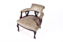 Victorian mahogany tub chair upholstered in sage green.