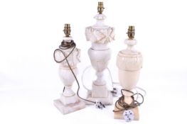 Three assorted alabaster table lamps. Of baluster form, raised on square bases.