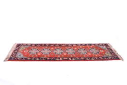 A Turkish Gumussuyu Lyric runner on a red ground.