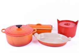 Four Le Creuset pots.