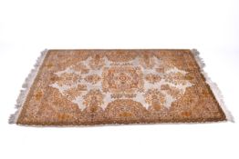 A Persian style wool rug on a cream ground.