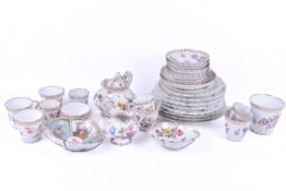 A collection of hand painted Dresden tablewares. Including cups, saucers and a tea pot, etc.