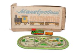 A vintage LMZ Russian USSR mechanical wind-up tin plate toy train set, boxed.