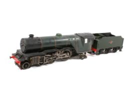 A scale model of a steam locomotive and tender, project. Dark green livery with red detailing.