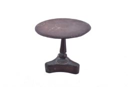 A 19th century brass miniature circular tilt-top table. Diameter 12.