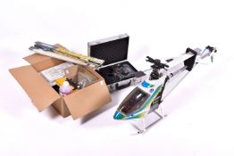 A Hirobo Shuttle Steady 30 nitro powered remote control model helicopter and accessories.