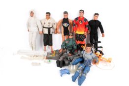 A collection of assorted Hasbro Action Man figures with uniforms and some accessories.