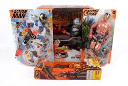 A group of four assorted Hasbro Action Man figures.