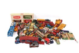 A large collection of assorted vintage playworn diecast model vehicles.