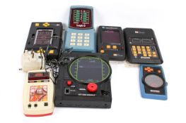 Collection of seven circa 1980 electronic hand held arcade game consoles.