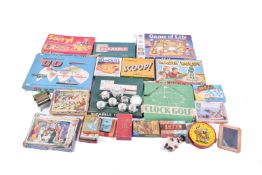 A collection of assorted vintage board games and wooden jigsaw puzzles.