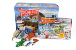 An assortment of Thunderbirds related toys.