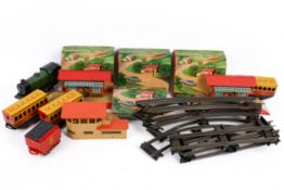An assortment of 0 gauge locomotives and layout accessories.