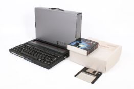 A Cambridge Z88 portable computer and a PC Link. S/n #0060039, boxed with user guide.